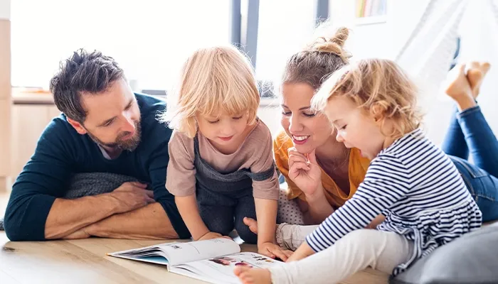 a family reads with their children